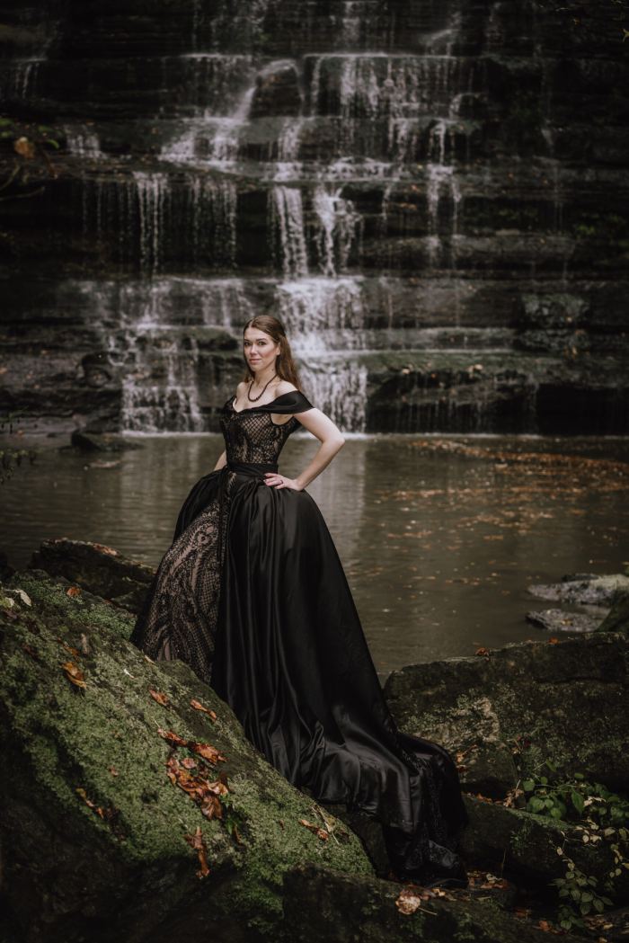 Bride in a black gown at a Tennessee waterfall elopement