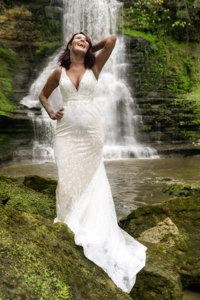 Bride in a fitted gown by the water at a Nashville elopement