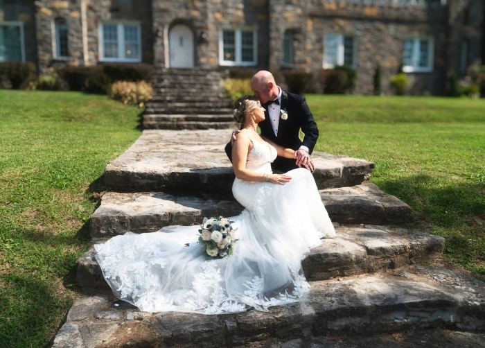 Bride on the stone steps of a grand Tennessee estate