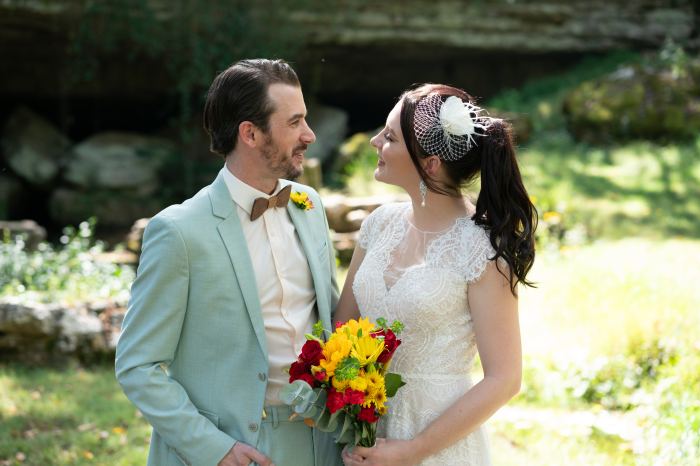 Couple with a bright bouquet at a Nashville garden elopement