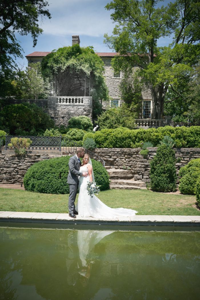 Couple at a garden estate with a reflecting pond near Nashville