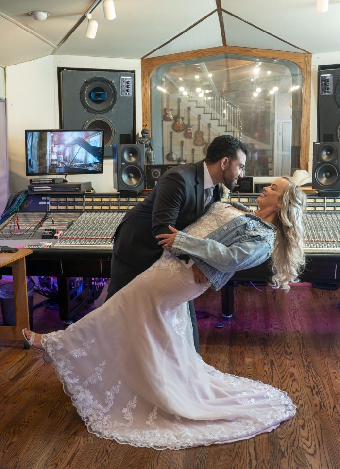 Couple at an indoor Nashville venue with a sweeping train