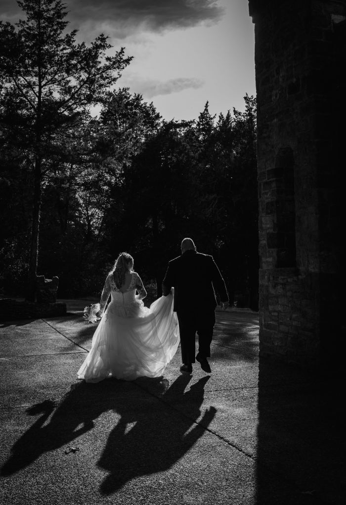 Couple in a moody Nashville garden at dusk