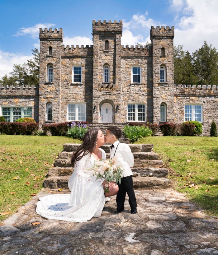 Couple on the steps of a castle wedding venue near Franklin Tennessee