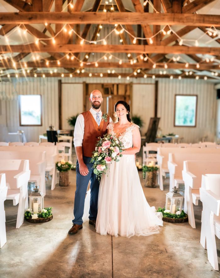 Couple at their string-lit indoor ceremony during a Nashville elopement