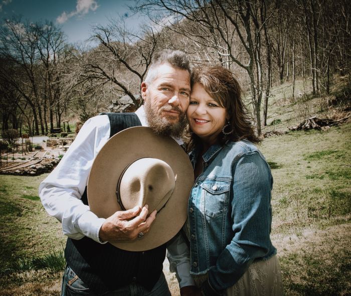 Couple in a Tennessee field at a countryside elopement