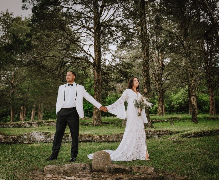 Couple walk hand in hand at a garden elopement near Nashville