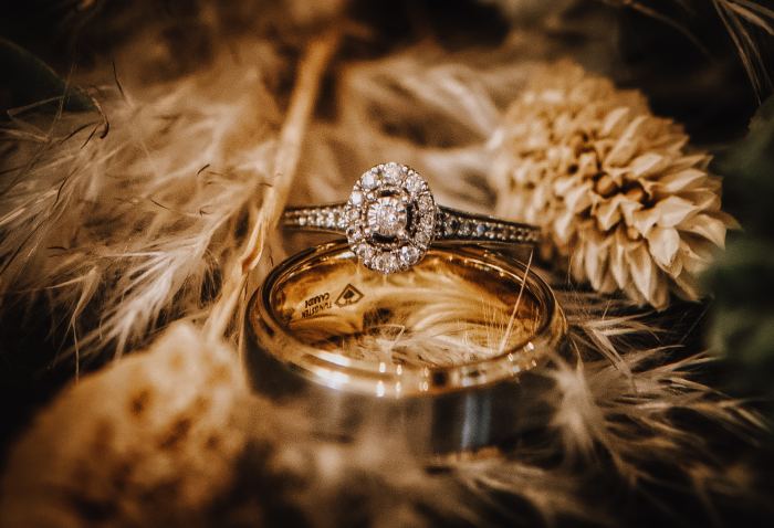 Wedding rings resting on dried florals, a Nashville elopement detail